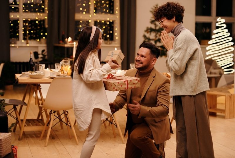 A Happy Girl Talks to Her Parents about a Gift