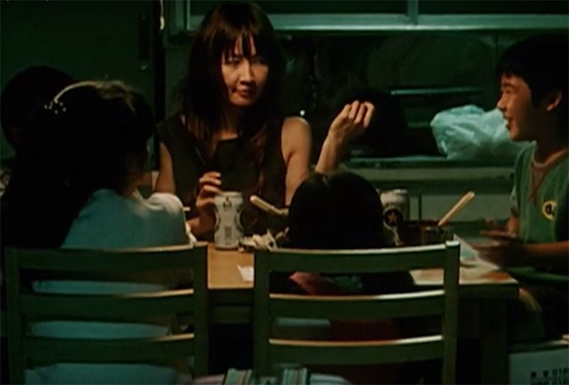 A mother and her four children on dining table