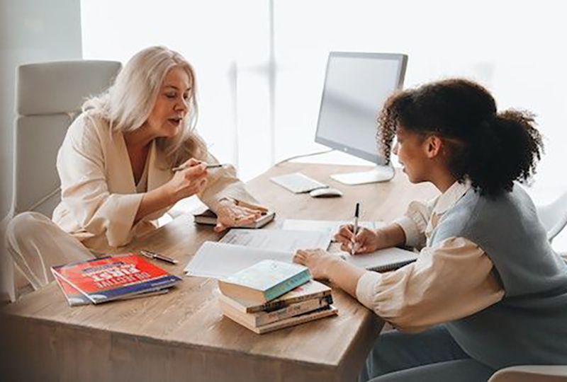 A teacher is discussing writing with her student