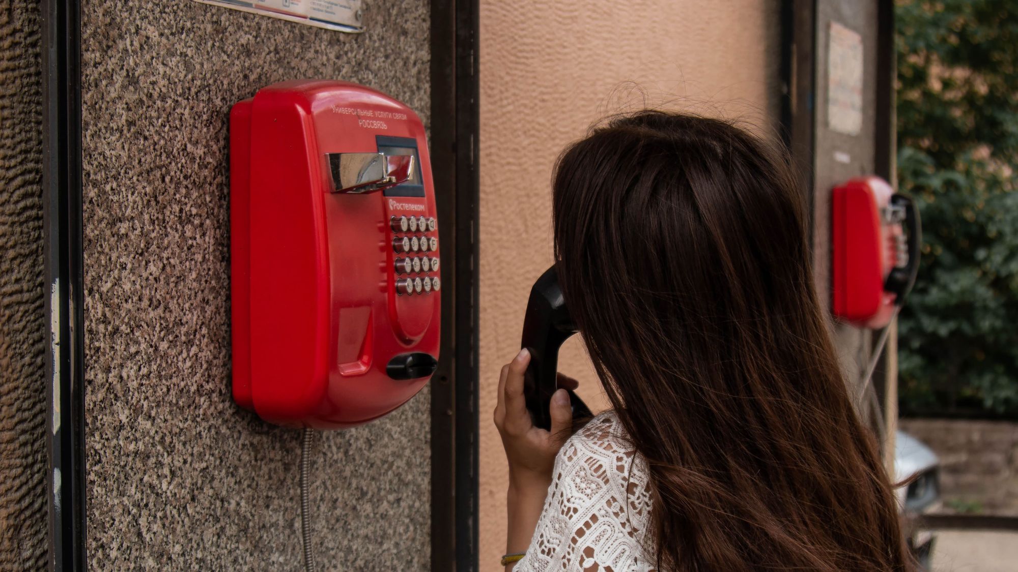 Woman on a payphone