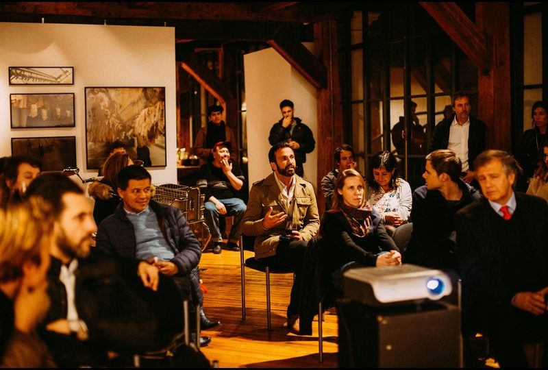 People sitting in a room listening to lecture