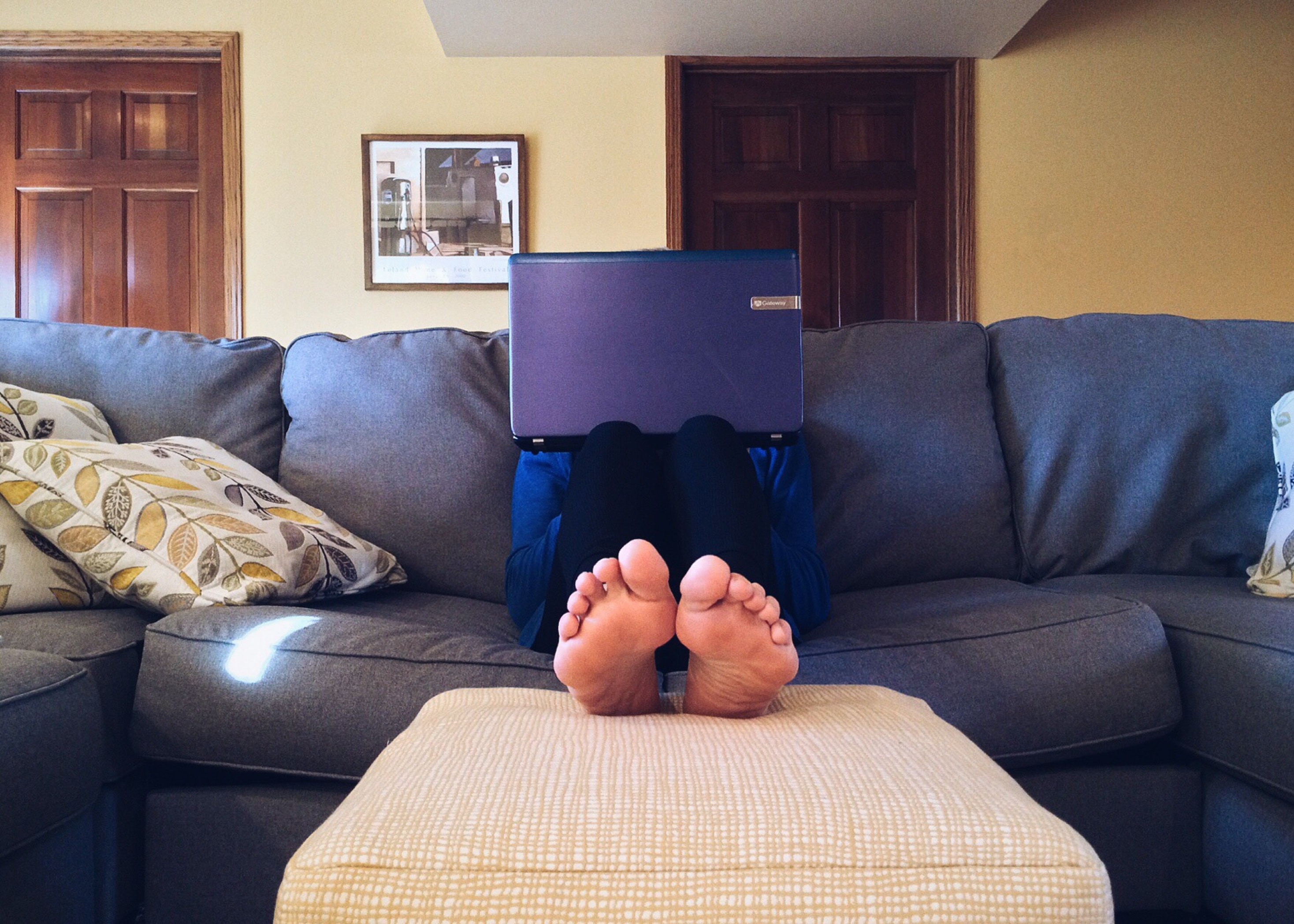 Guy with notebook on couch