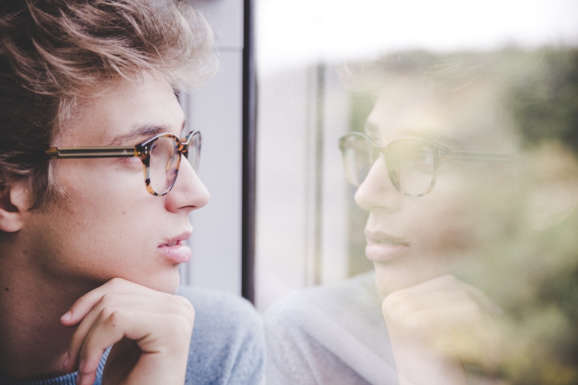 boy with glasses thinking