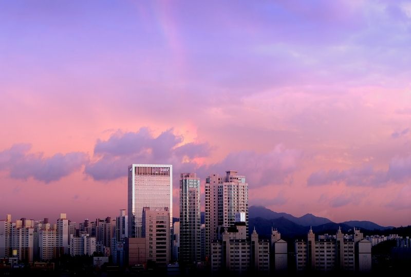 Buildings under cloudy sky