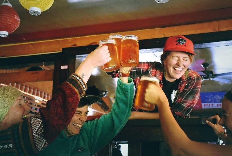 Cheers with Beer in a Bar in Brazil