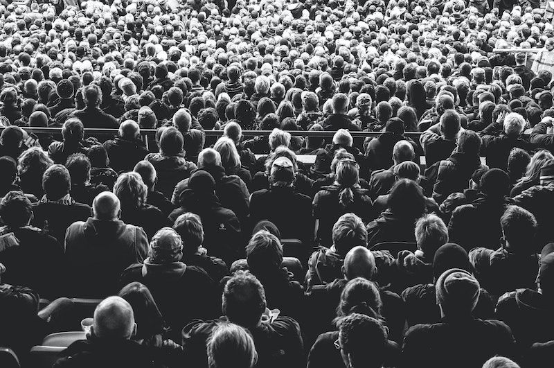 People Sitting In A Audience