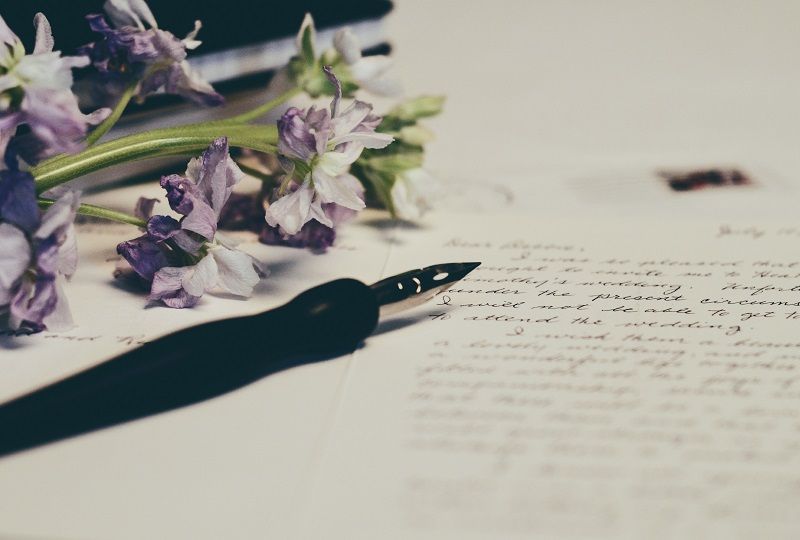 A written letter and some flowers