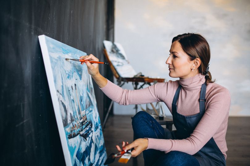 female artist painting studio