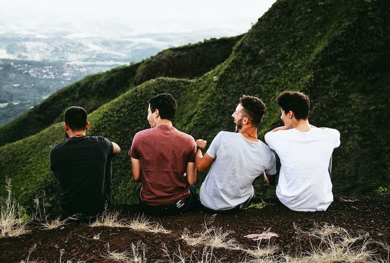 Four friends laughing together