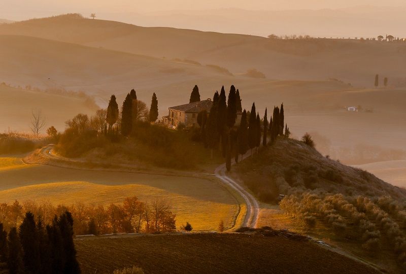 Dawn over a farmhouse in the Tuscan countryside