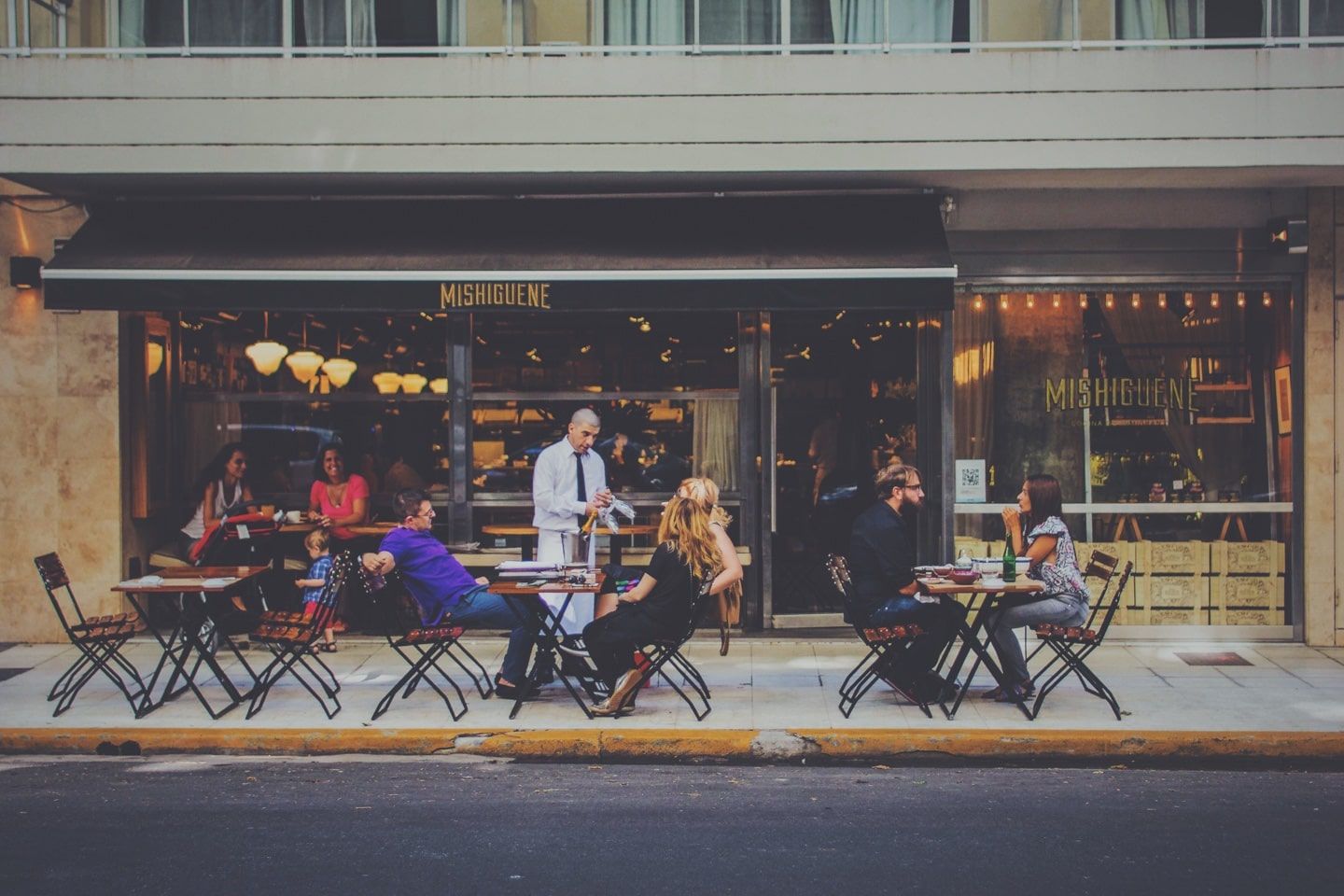 People conversing at a cafe