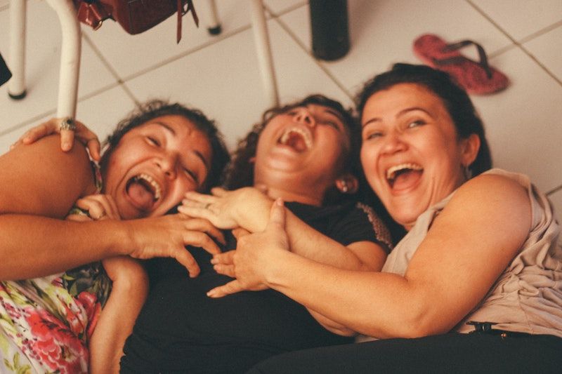 Girls Laughing on ground