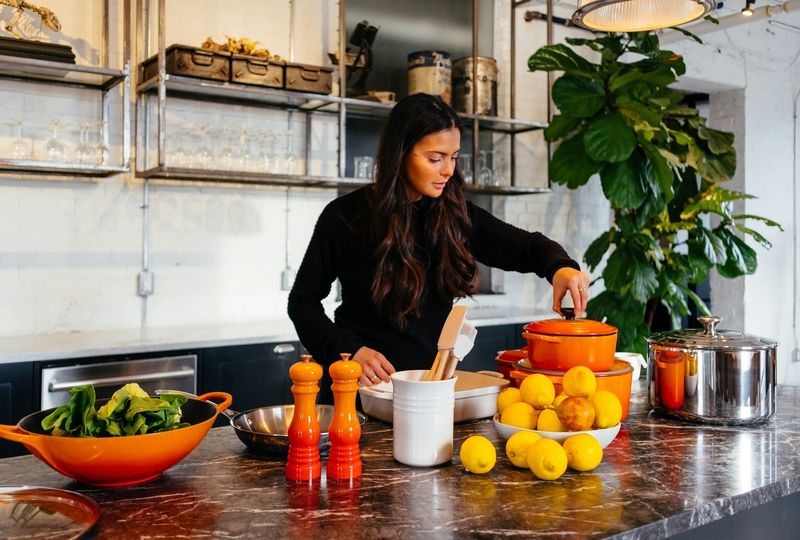 woman cooking in a modern style kitchen