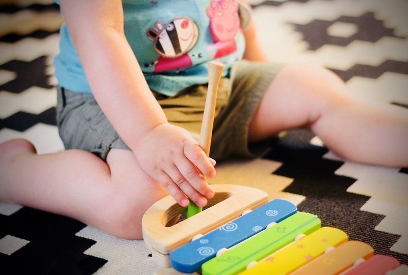 Child playing xylophone