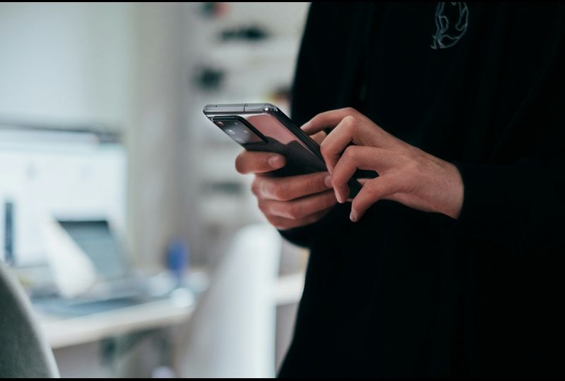 person using a phone to improve english speaking skills