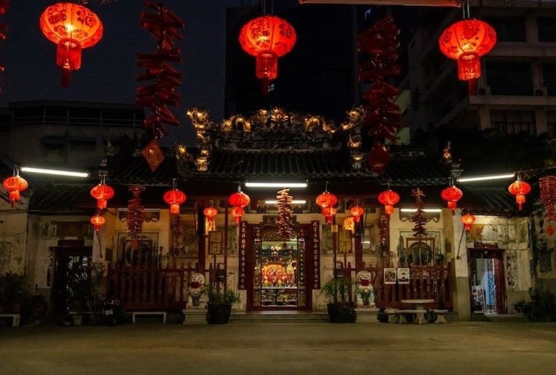 Chinese temple with red lanterns lit up