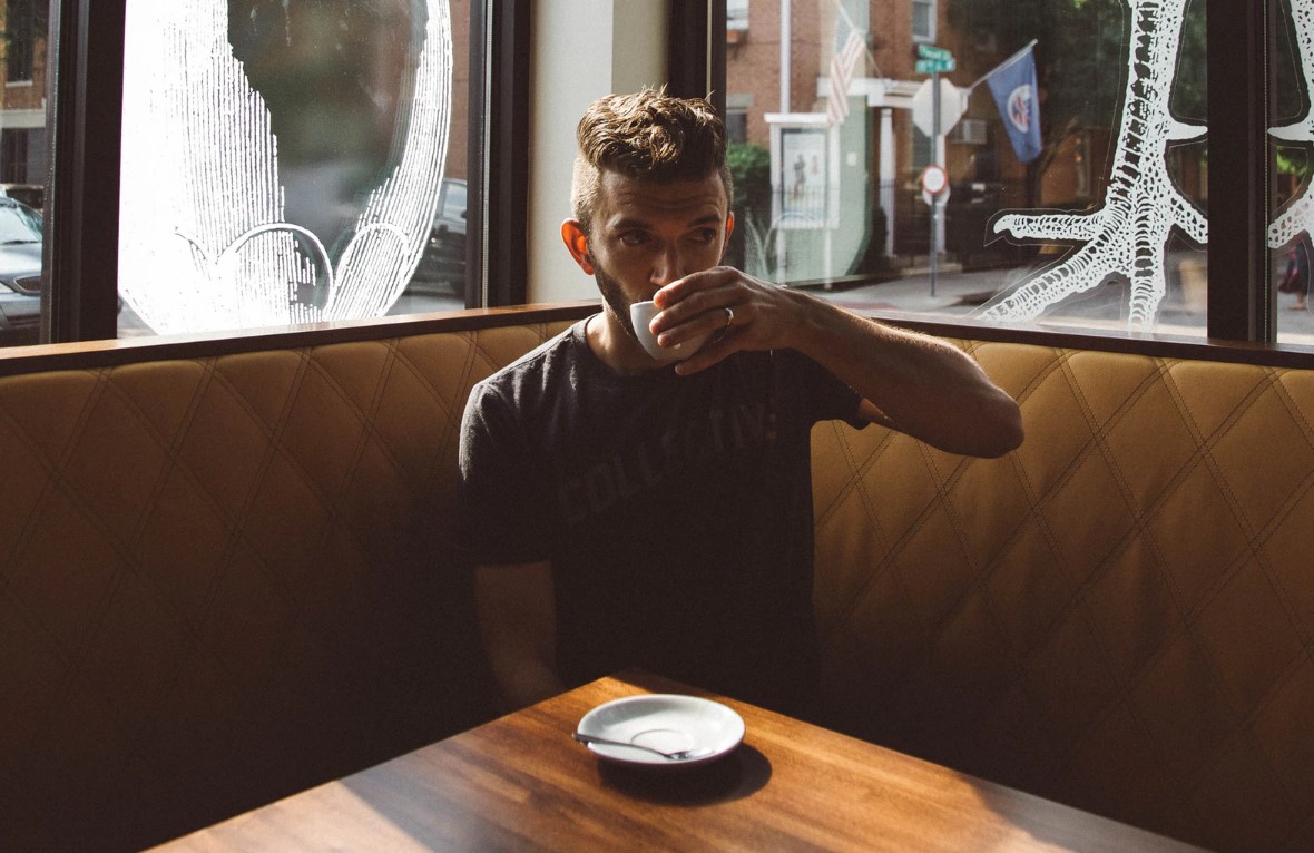 man drinking coffee by himself