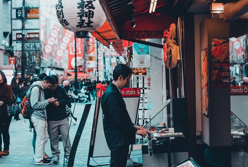 man in front of store