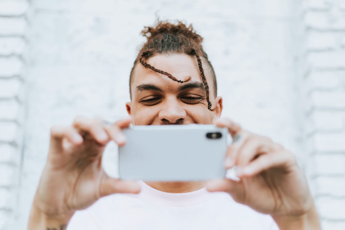 man speaking on phone via video call