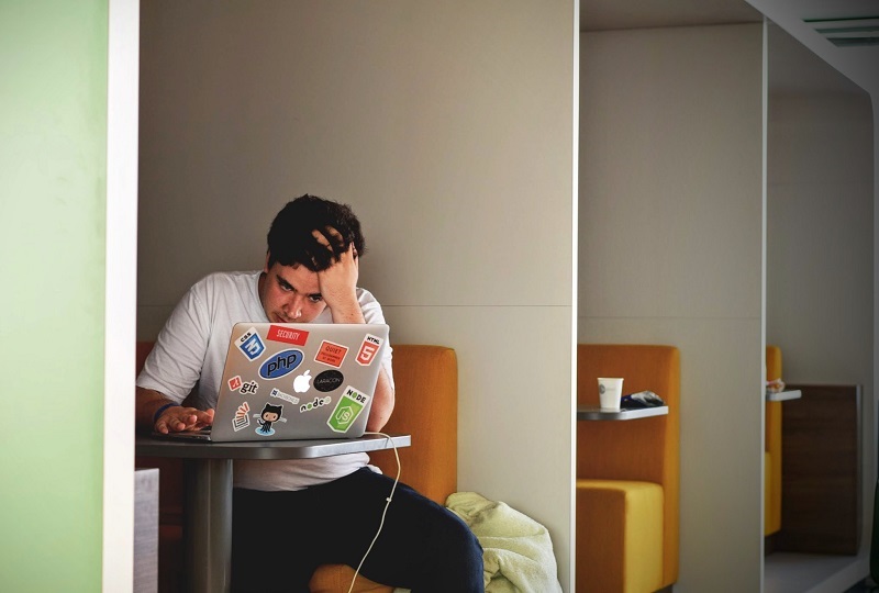 Man watching his laptop screen