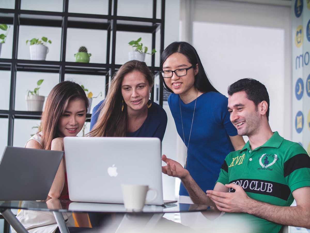 A group of people on computers