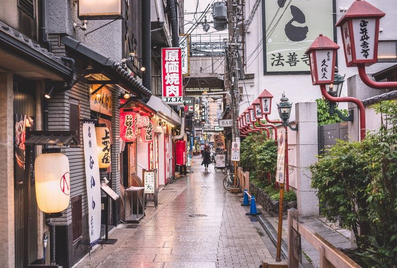 person walking on Japanese street