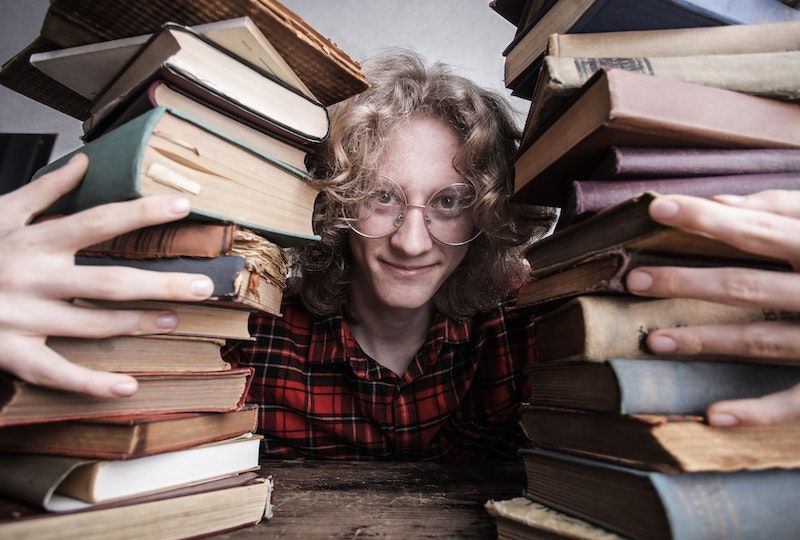 Person hugging old books.