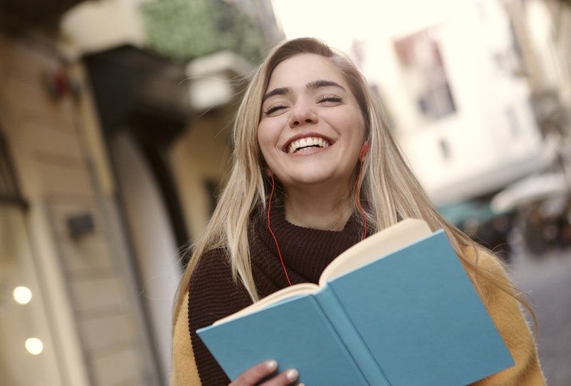 girl holding a book