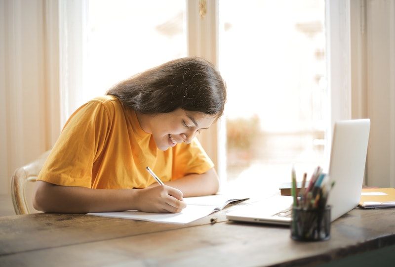 A girl studies French at home.