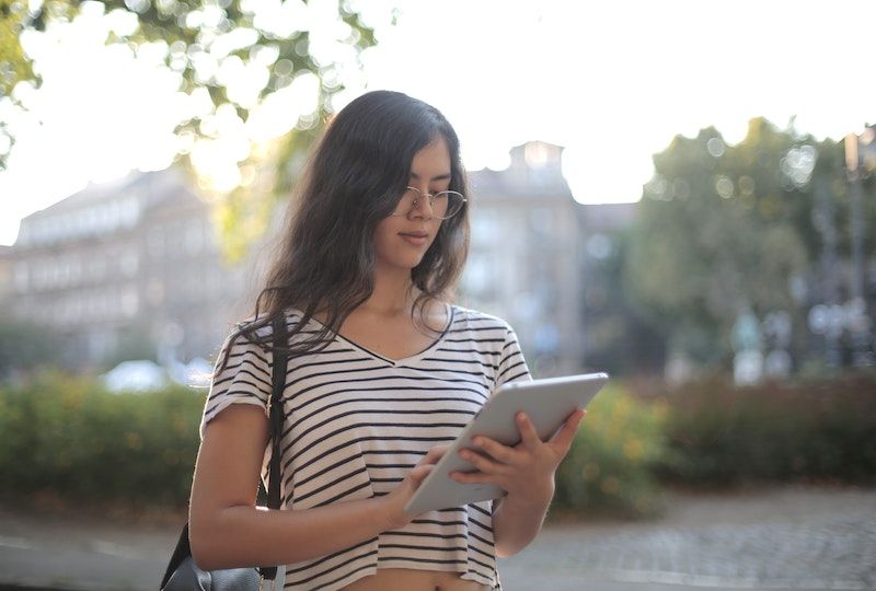 woman holding a tablet