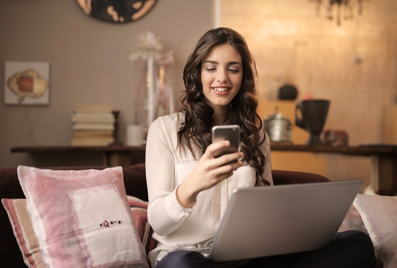 girl using smartphone at home