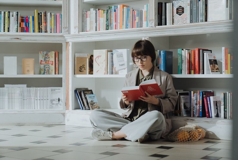 girl reading in a library