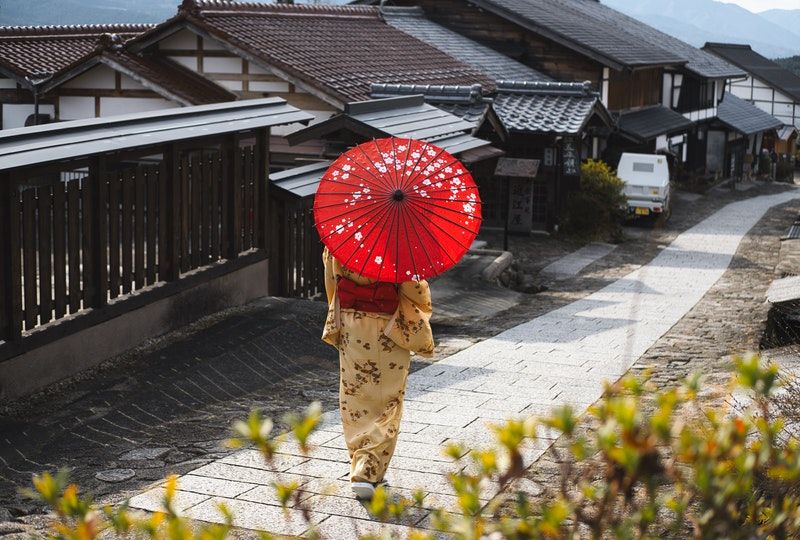 woman walking with an umbrella