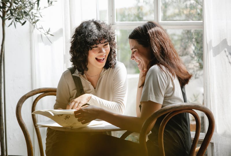 Two girls having a conversation in French