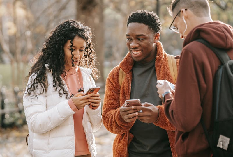 Group of friends texting and chatting.