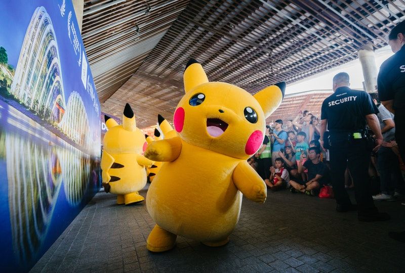 Pikachu characters interacting with people