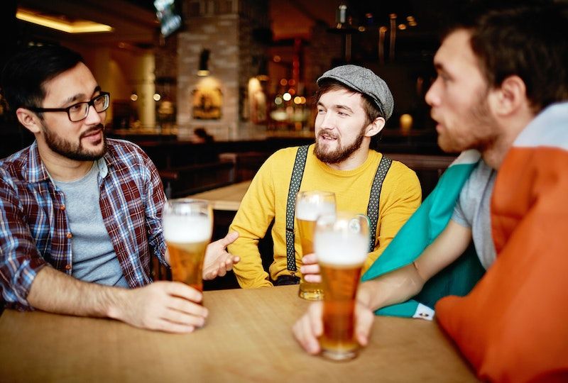 Group of young men drinking together