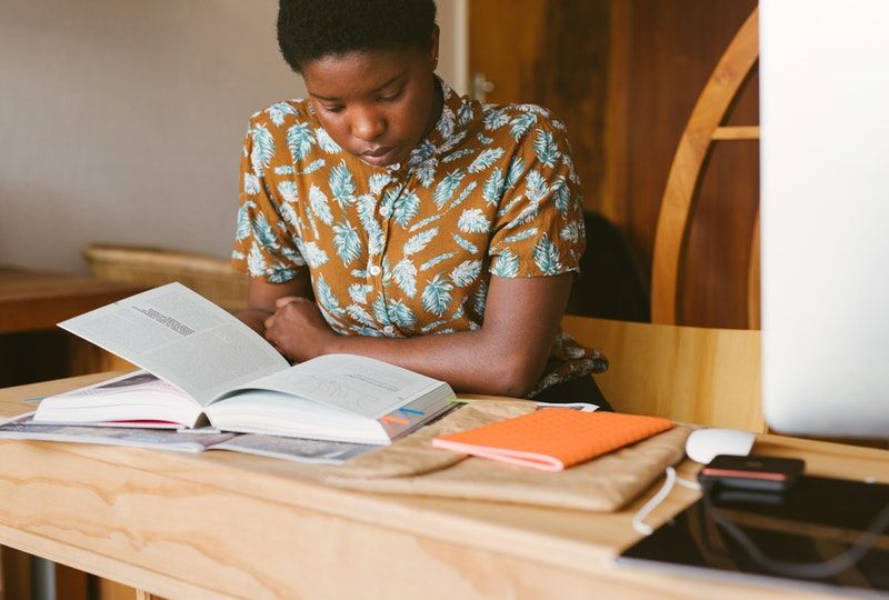 woman studying at a table