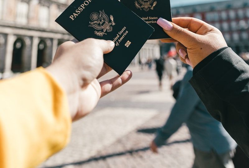 couple holding passports