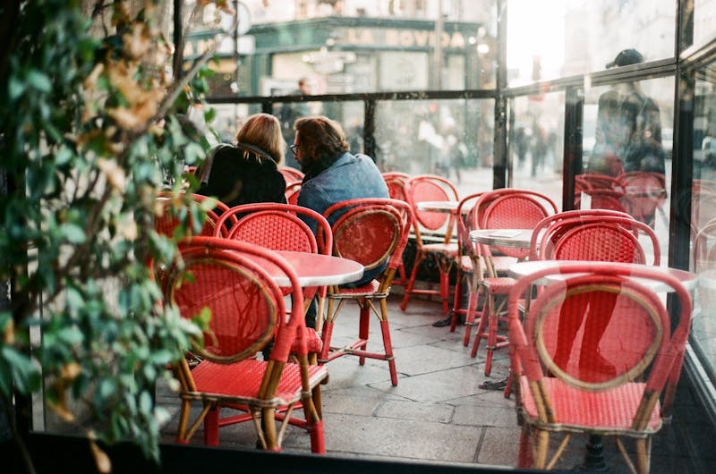 People chatting in a French cafe.