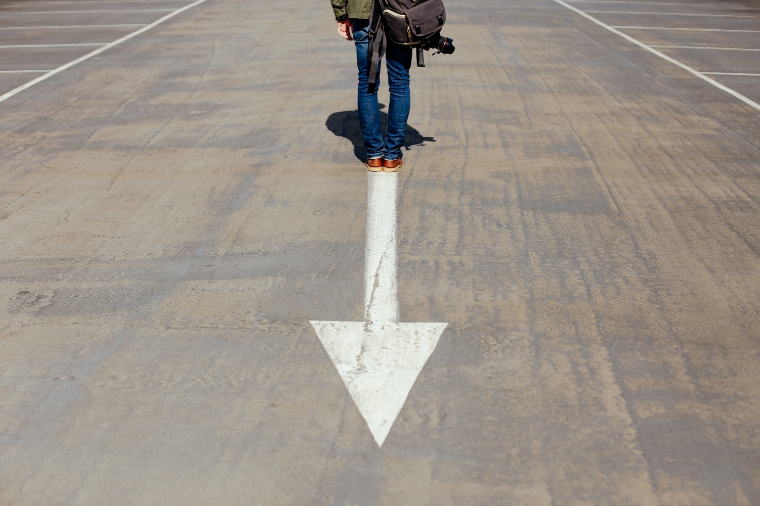 man on arrow in the street