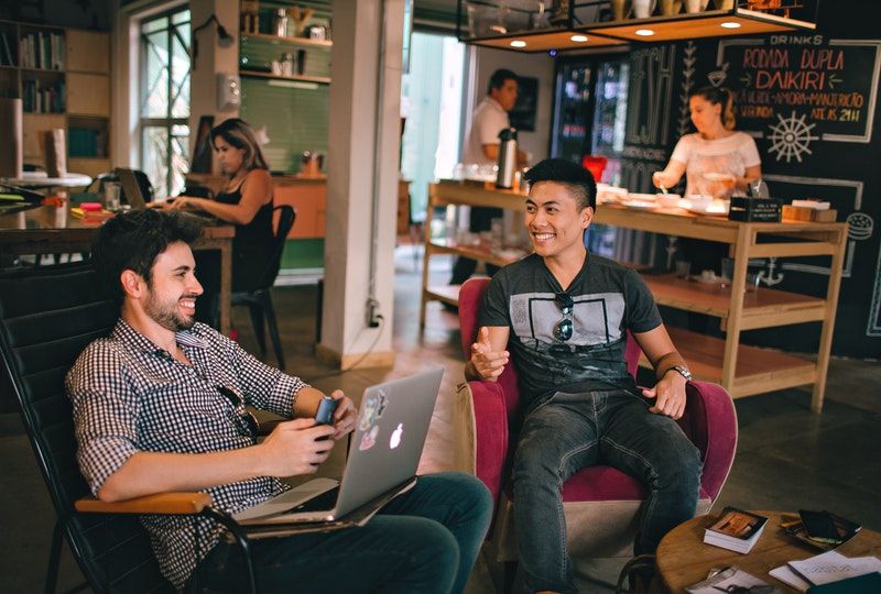 men having seated conversation