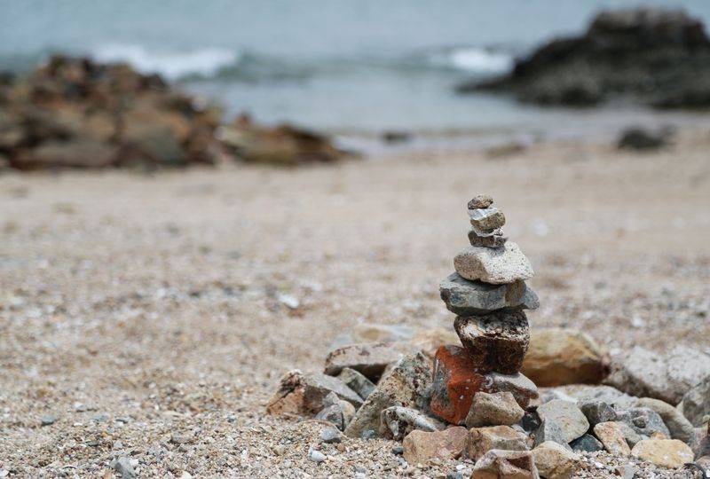 Rocks stacked in the sand