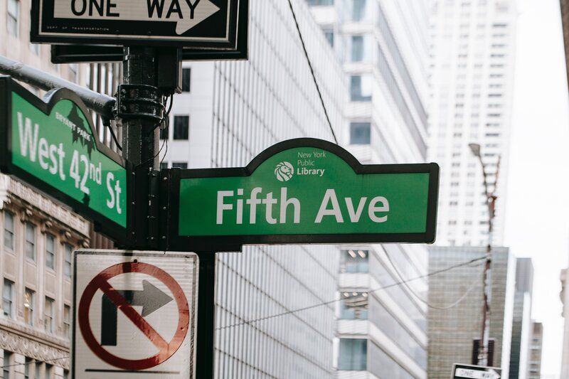 new york street sign saying fifth ave