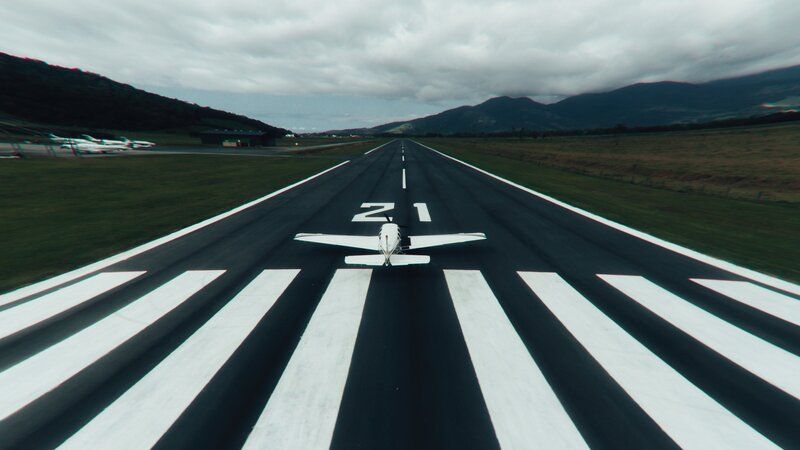 a plane on a runway about to take off