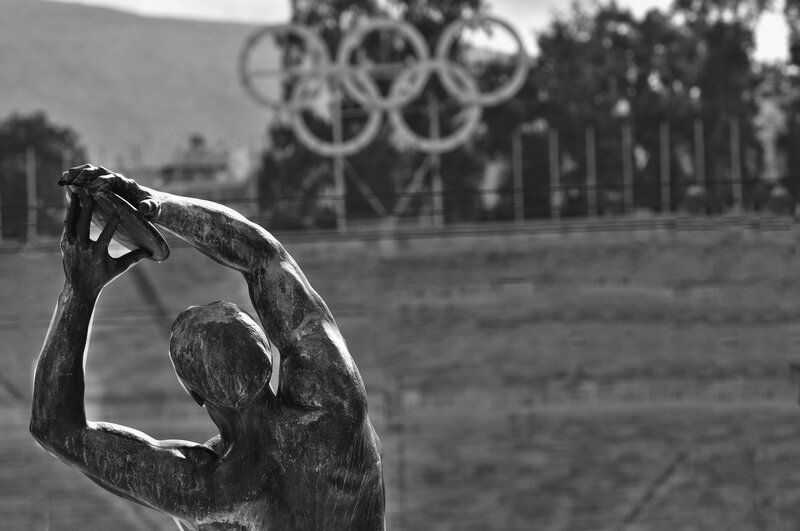 black and white image of a greek statue