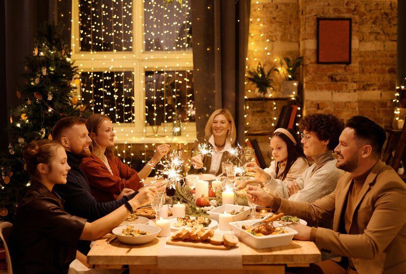 friends sitting at a dinner table together