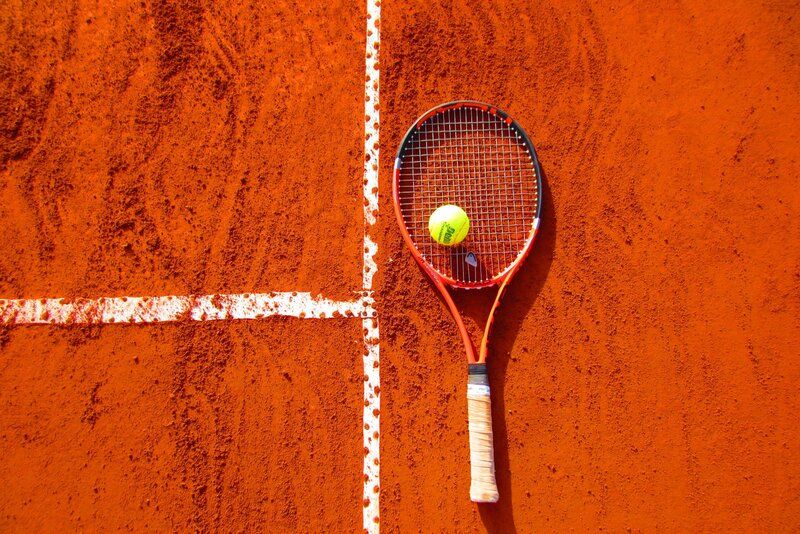 picture of a tennis raquet and ball