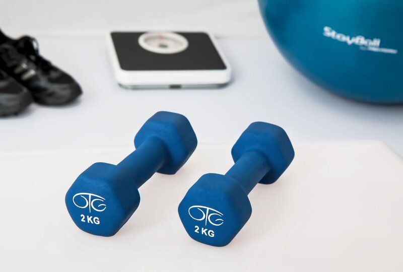 work-out equipment including weights and a scale