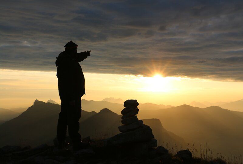 man looking at a sunset